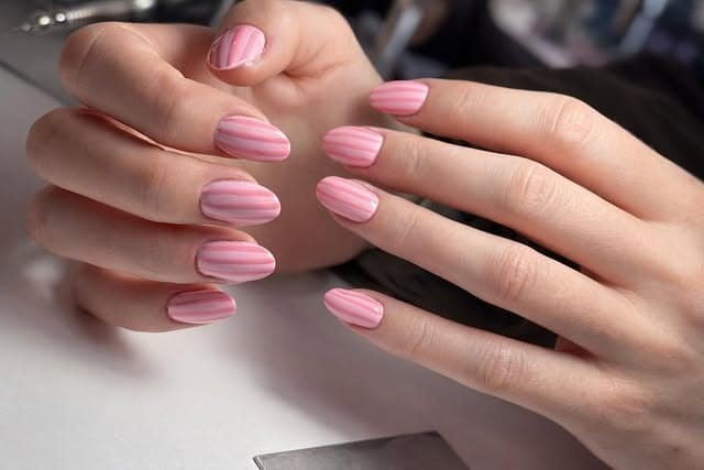 17. Candy Pink Almond Nails with Stripe Detail - soft pink nail ideas