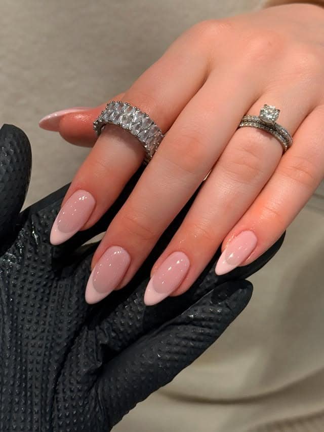 19. Nude Pink Almond Nails with Subtle Sparkle - soft pink nail ideas