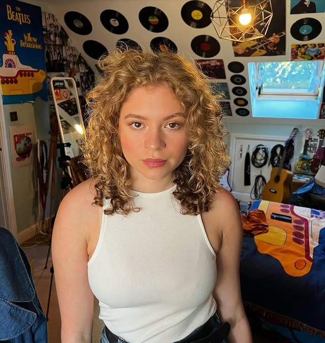 1. Golden Blonde Curly Shag - Hippie Haircuts