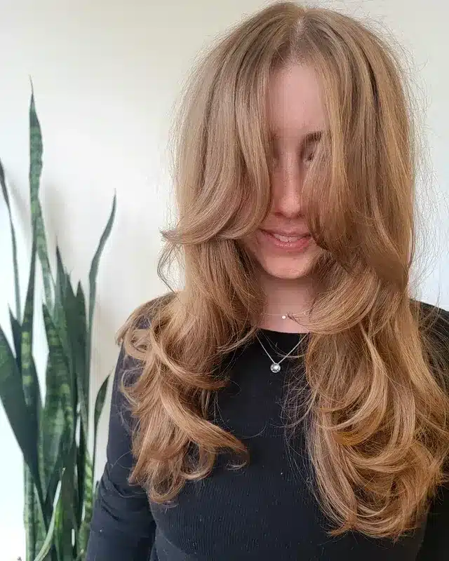 4. Long Feathered Layers in Honey Blonde - Hippie Haircuts