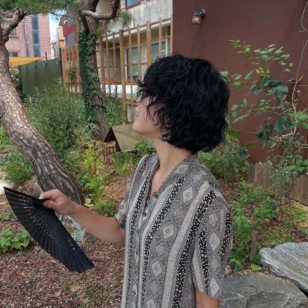 8. Short Tousled Shag with Soft Waves in Dark Espresso - Hippie Haircuts