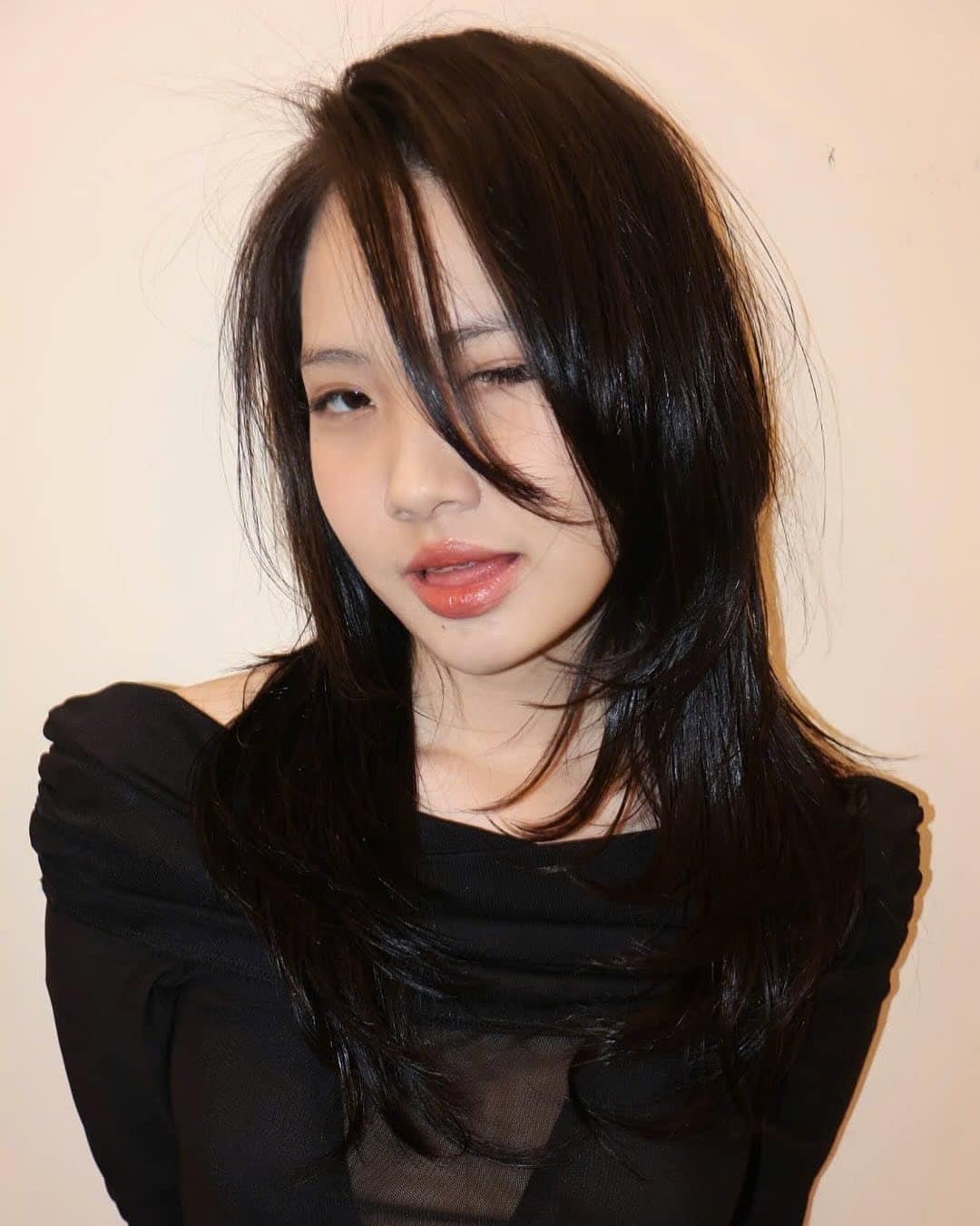 14. Sleek Layered Cut with Face-Framing Pieces in Jet Black - Hippie Haircuts