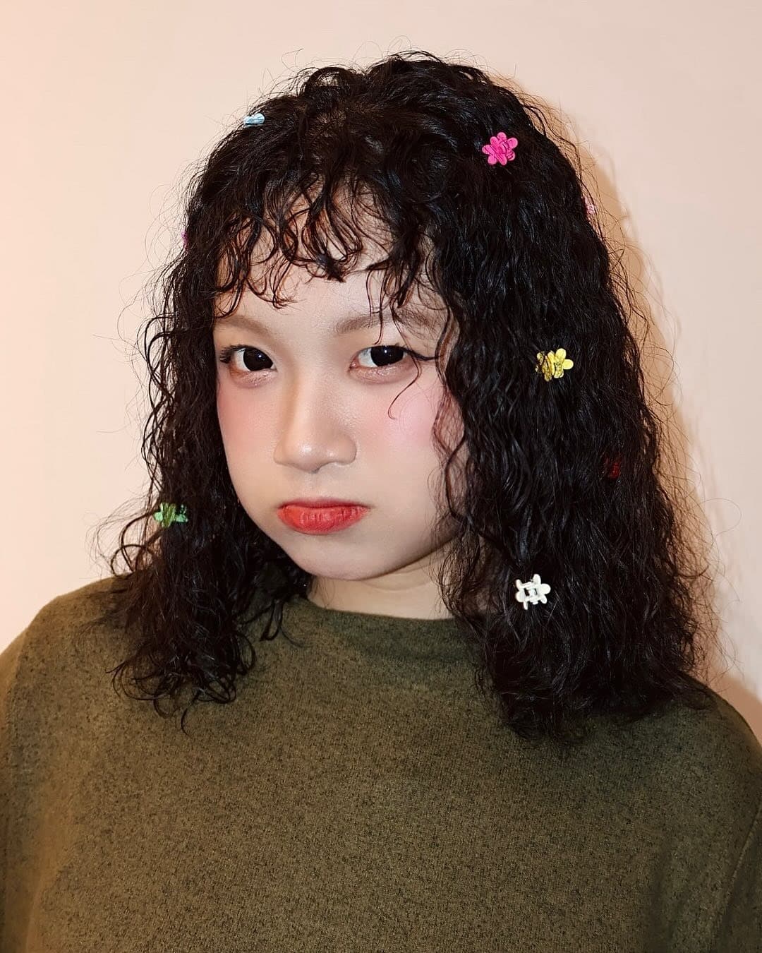 16. Short Curly Bob with Micro Fringe in Soft Black - Hippie Haircuts