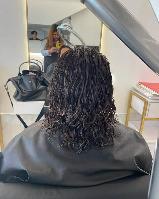 18. Medium-Length Wet-Look Waves in Deep Brown - Hippie Haircuts