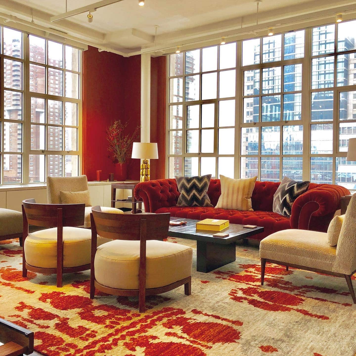 5. Urban Loft Living Room with Deep Red Accents - red living room ideas