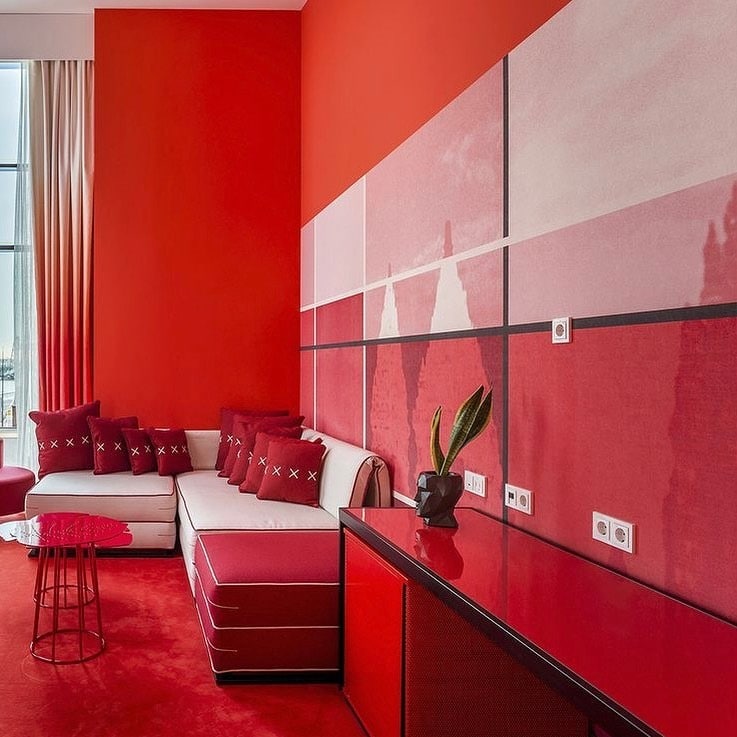 12. Contemporary Red Monochrome Living Room with Geometric Wall Design - red living room ideas
