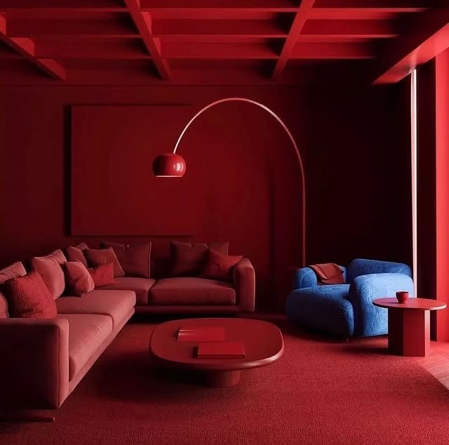 20. Moody Red Living Room with Minimalist Sculptural Elements - red living room ideas