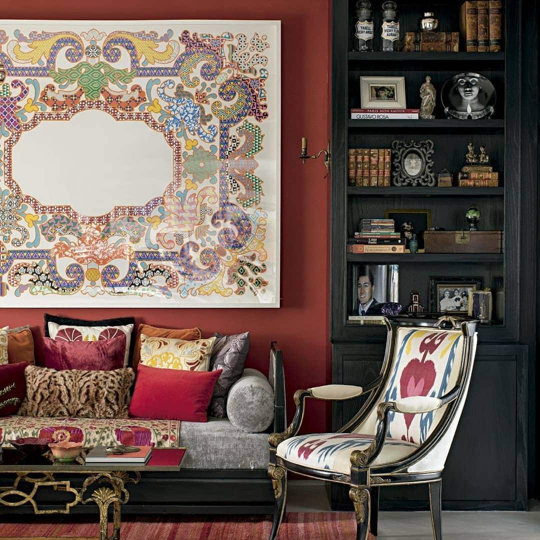 21. Eclectic Red Living Room with Artistic Wall Statement - red living room ideas