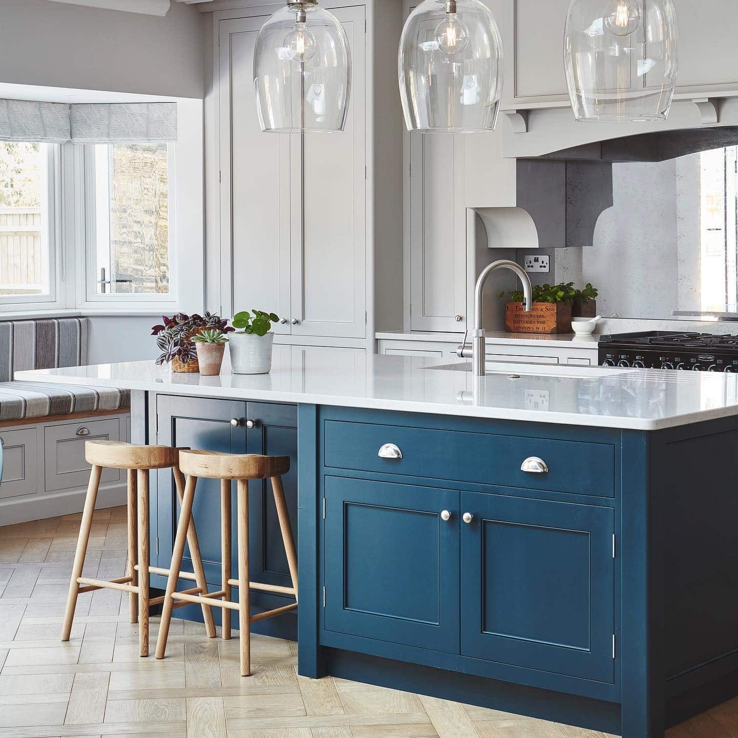 1. Navy Blue Island with Soft Gray Shaker Cabinetry - blue and gray kitchen ideas