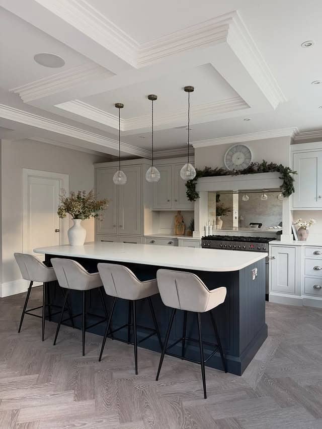 10. Navy Island with Pale Gray Cabinetry and Architectural Ceiling Detail - blue and gray kitchen ideas
