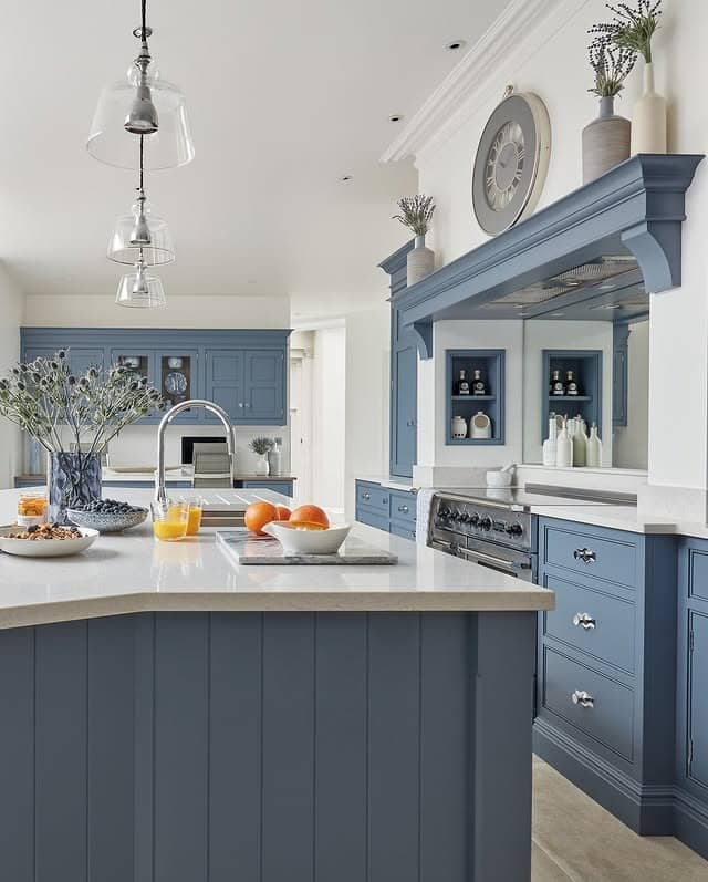 14. Dusty Blue Cabinetry with White Surround and Traditional Detailing - blue and gray kitchen ideas