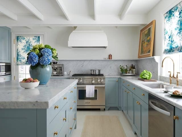 19. Soft Blue Cabinetry with Marble Surfaces and Brass Hardware - blue and gray kitchen ideas