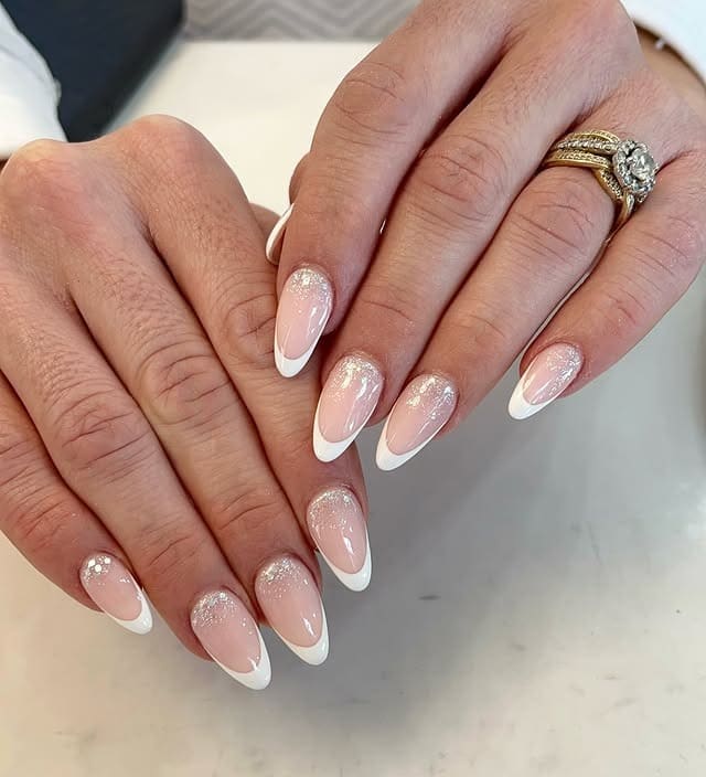 6. Classic French Fade with Subtle Glitter - sophisticated nail ideas