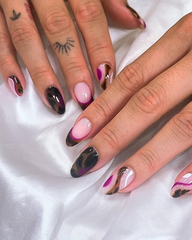 10. Abstract Swirl Almond Nails in Black and Berry Tones - sophisticated nail ideas