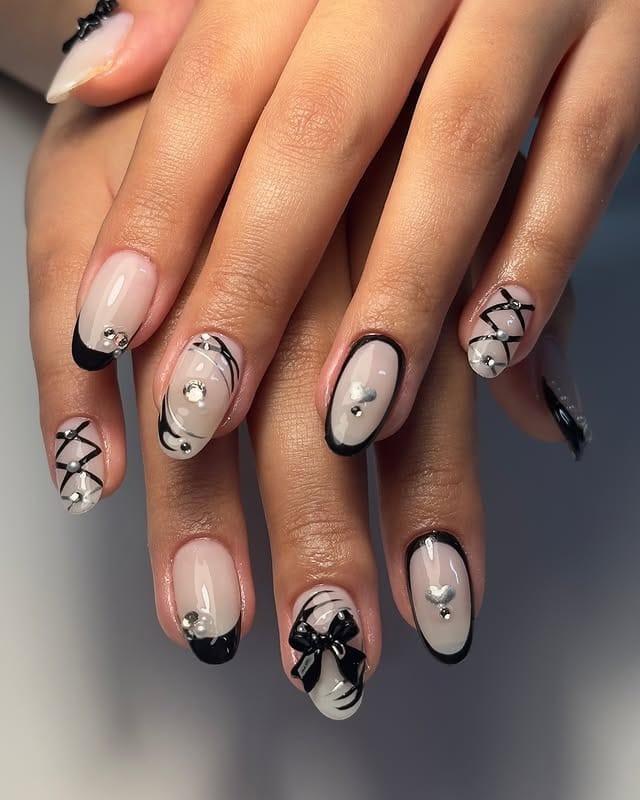 14. Black and Nude Graphic Almond Nails with Rhinestones - sophisticated nail ideas