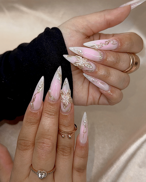 15. Blush Pink and White Floral Stiletto Nails with Gold Detailing - sophisticated nail ideas
