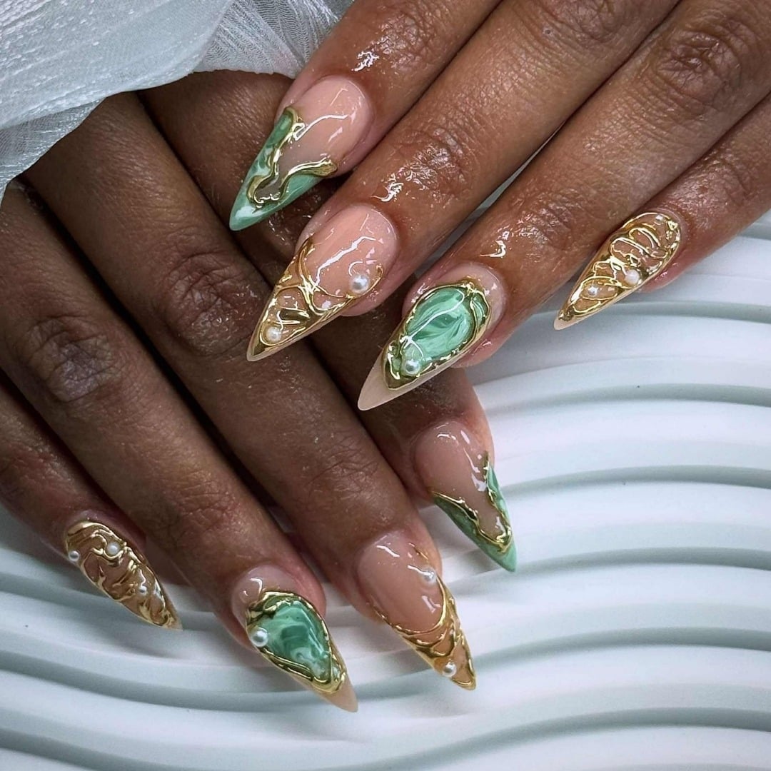 17. Sage Green and Gold Marble Stiletto Nails with Pearl Accents - sophisticated nail ideas