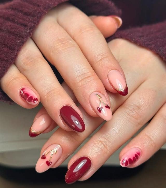 19. Burgundy Heart Accent Almond Nails - sophisticated nail ideas