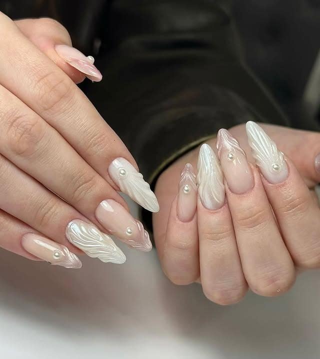 21. Pearl Embossed Milky White Stiletto Nails - sophisticated nail ideas