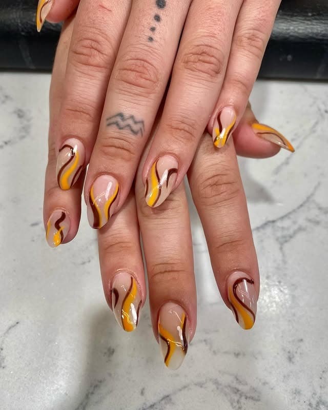 3. Nude Gloss Nails with Mustard and Chocolate Swirls - squiggle nail ideas