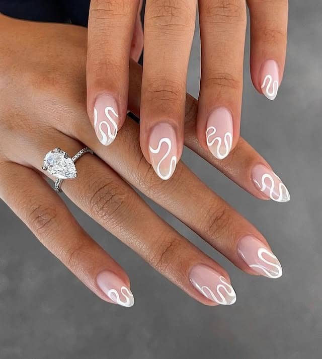 5. Classic French Almond Nails with White Squiggle Detail - squiggle nail ideas