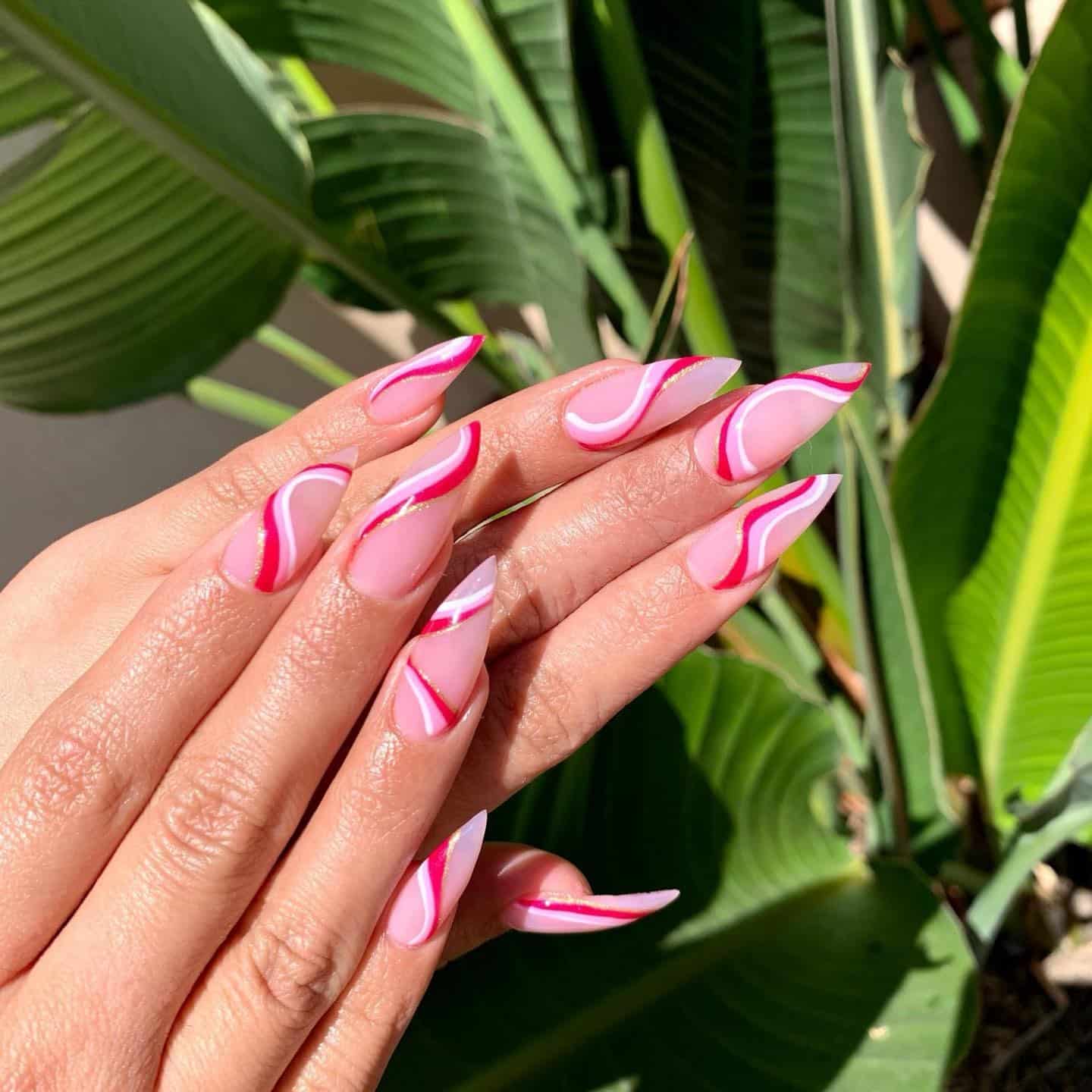 6. Long Pink Stiletto Nails with Layered Squiggle Lines - squiggle nail ideas