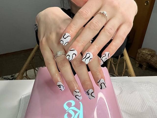 7. White Square Nails with Black Abstract Squiggles - squiggle nail ideas
