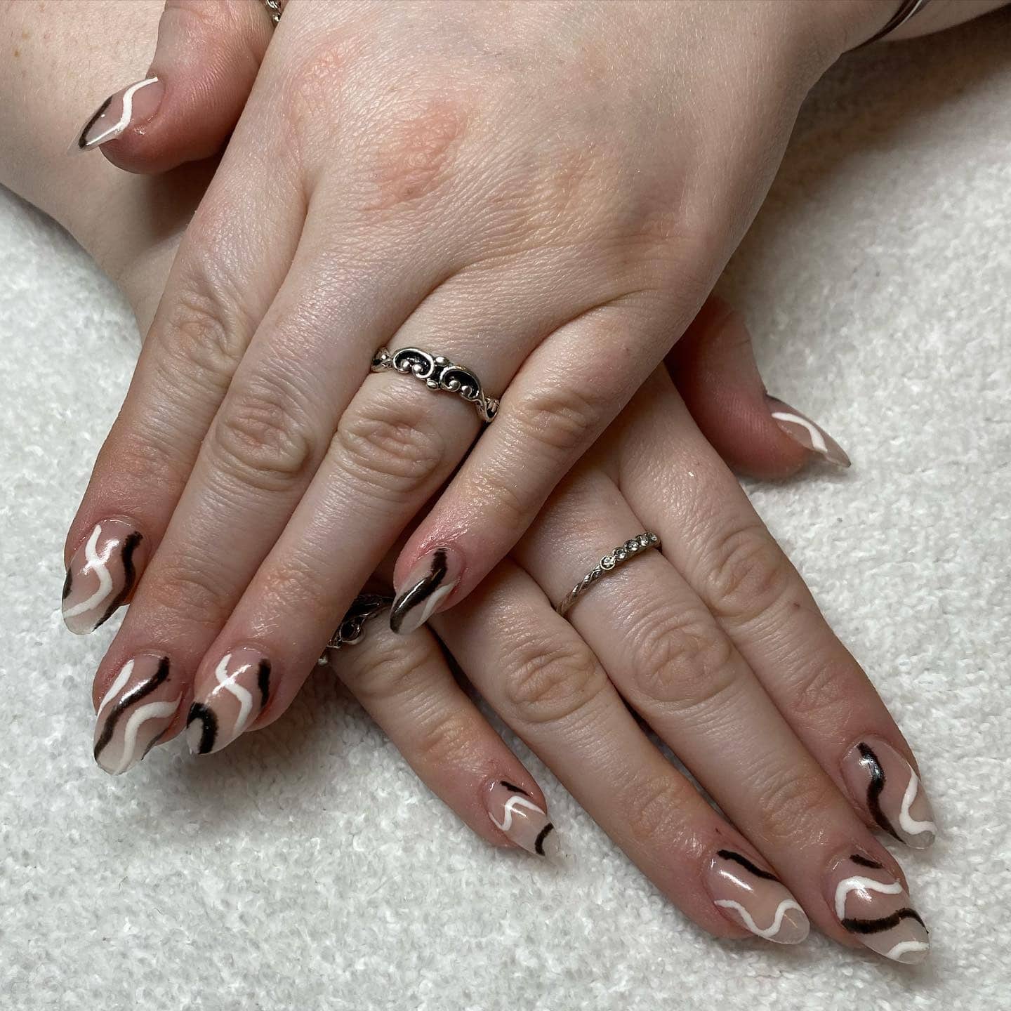 15. Sheer Nude Almond Nails with Black and White Squiggle Contrast - squiggle nail ideas