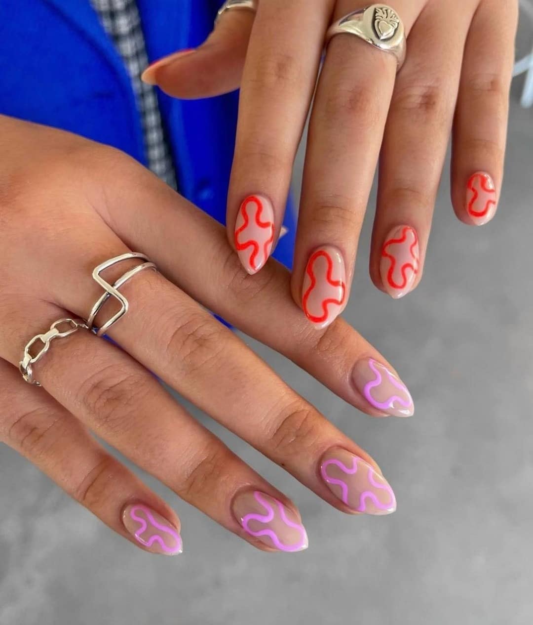 17. Nude Almond Nails with Red and Lilac Squiggle Outlines - squiggle nail ideas