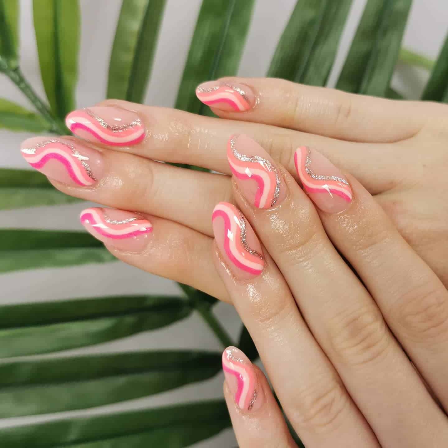 18. Glossy Pink Almond Nails with Glitter Squiggle Accents - squiggle nail ideas