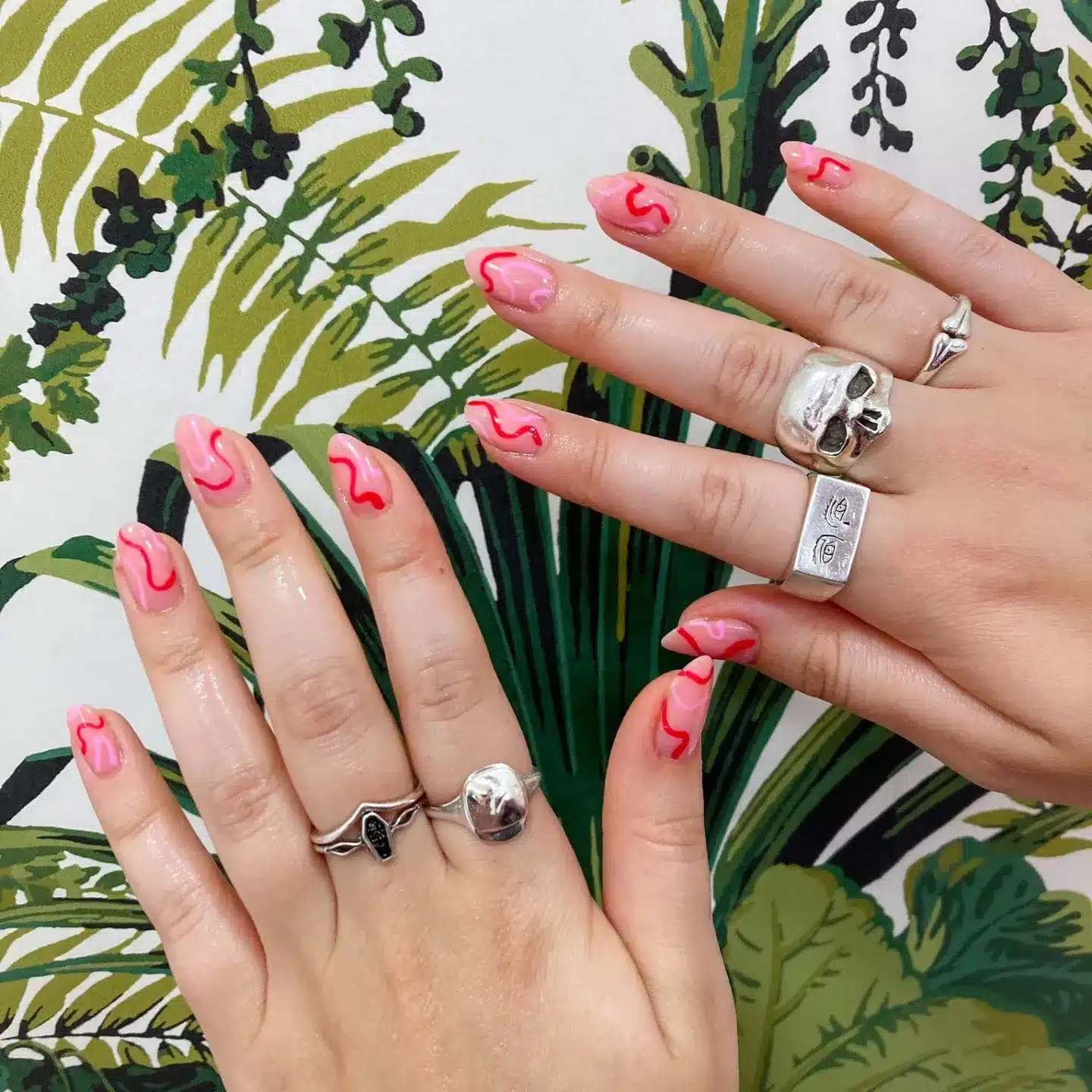 20. Short Almond Pink Nails with Red Squiggle Details - squiggle nail ideas