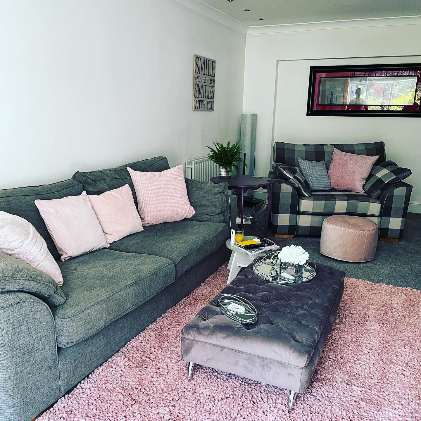 1. Soft Blush Accents with Charcoal Grey Sofa - pink and grey living room ideas