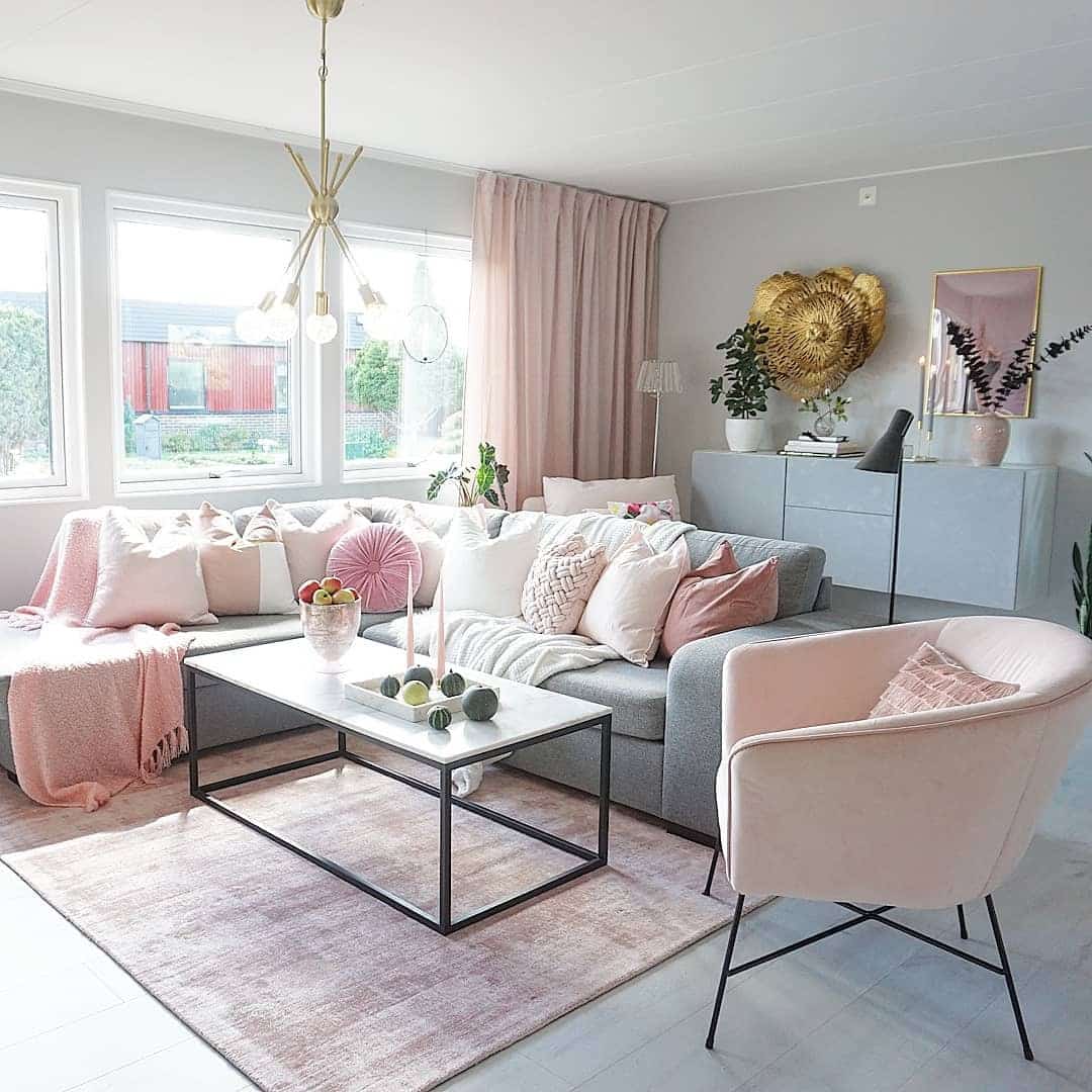 3. Light-Filled Grey Living Room with Layered Pink Textures - pink and grey living room ideas