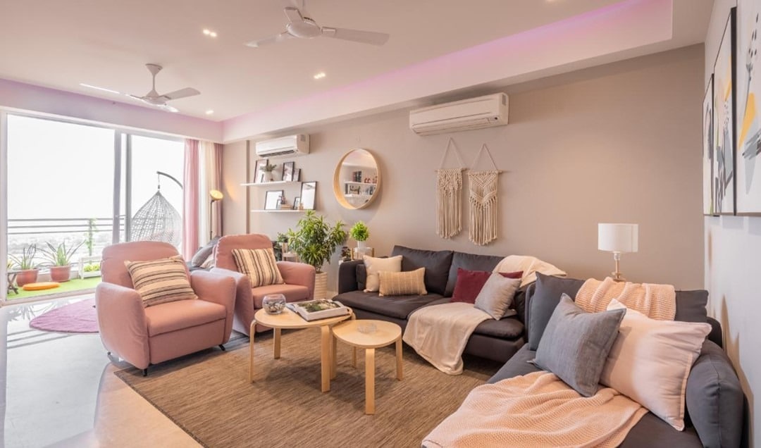 9. Open-Plan Grey Living Space with Gentle Pink Layers - pink and grey living room ideas