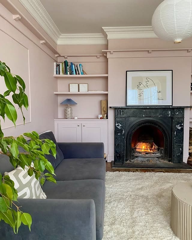 12. Dusty Pink Walls with Charcoal Grey Sofa Contrast - pink and grey living room ideas