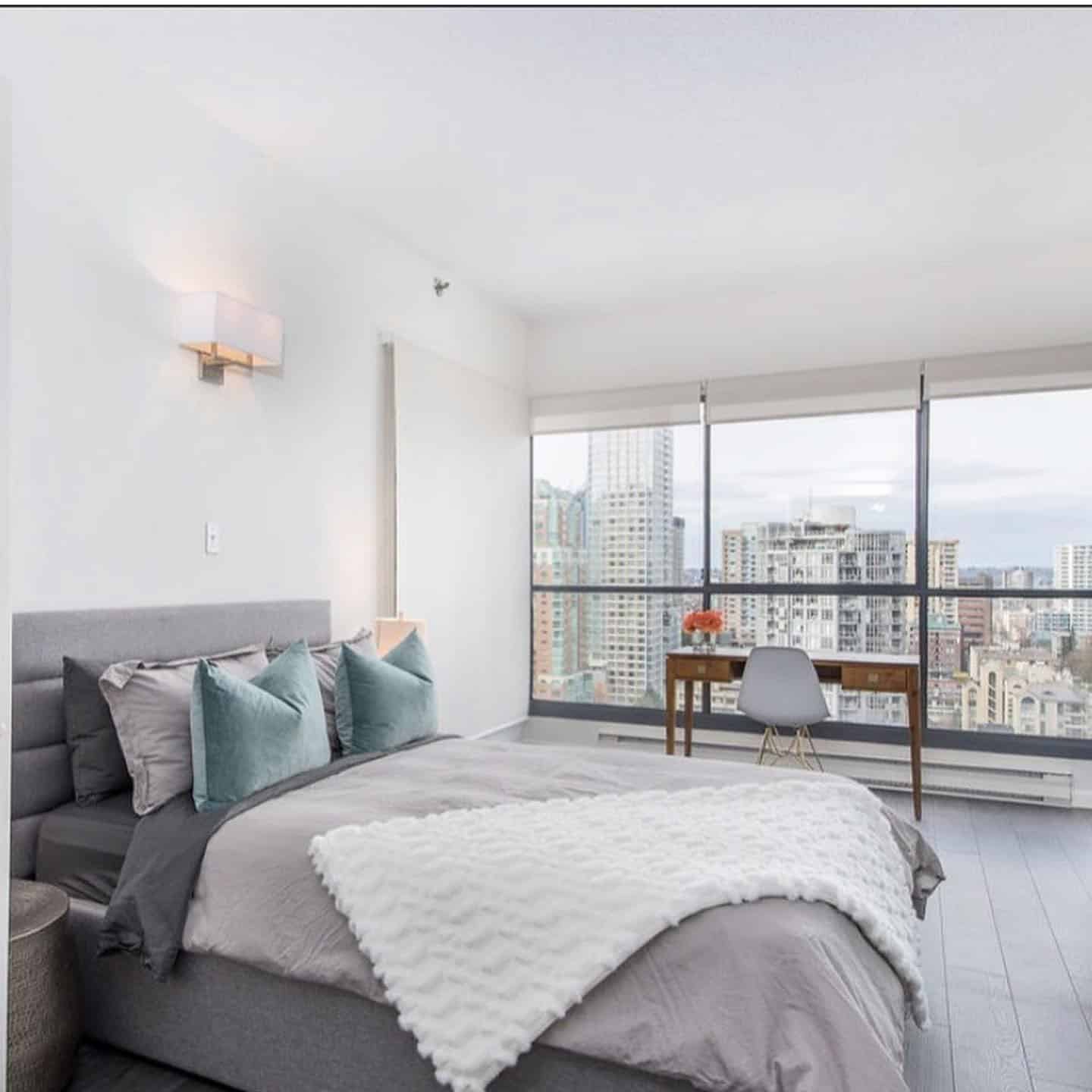 7. Modern City Bedroom Office with Expansive Views - bedroom office ideas