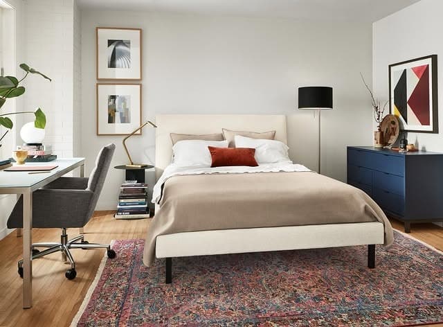 10. Balanced Modern Bedroom Office with Warm Accents - bedroom office ideas