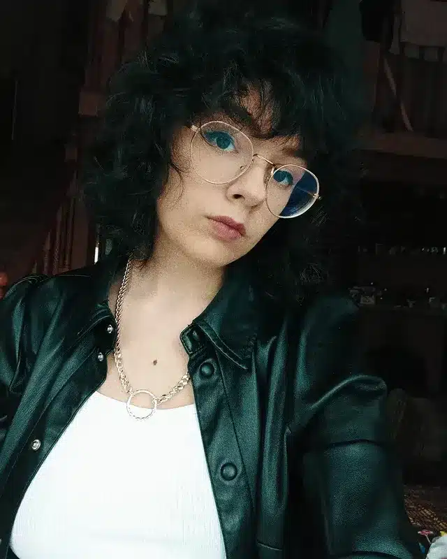 8. Short Curly Shag with Fringe in Deep Black - Short Fluffy Hair