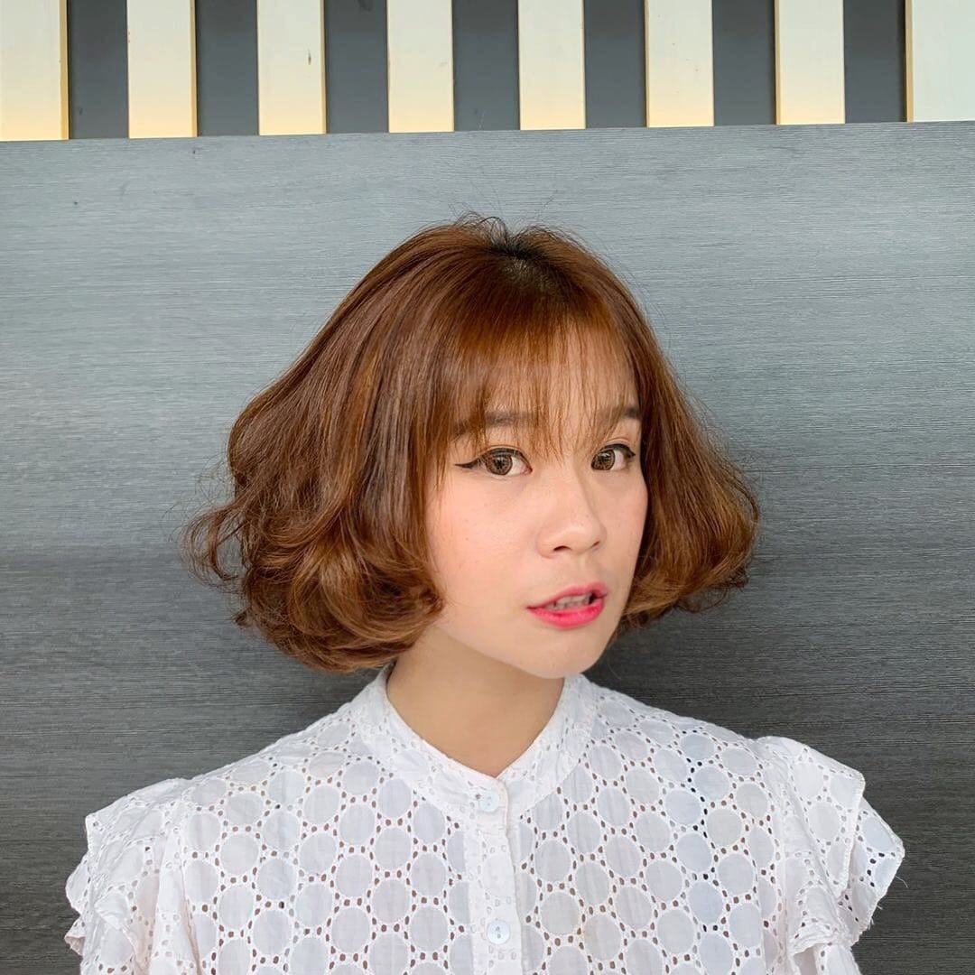 10. Rounded Short Bob with Soft Bangs in Light Brown - Short Fluffy Hair