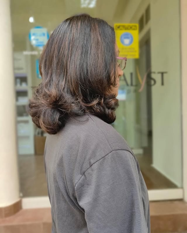 14. Rounded Shoulder-Length Brunette with Flipped Ends - Short Fluffy Hair