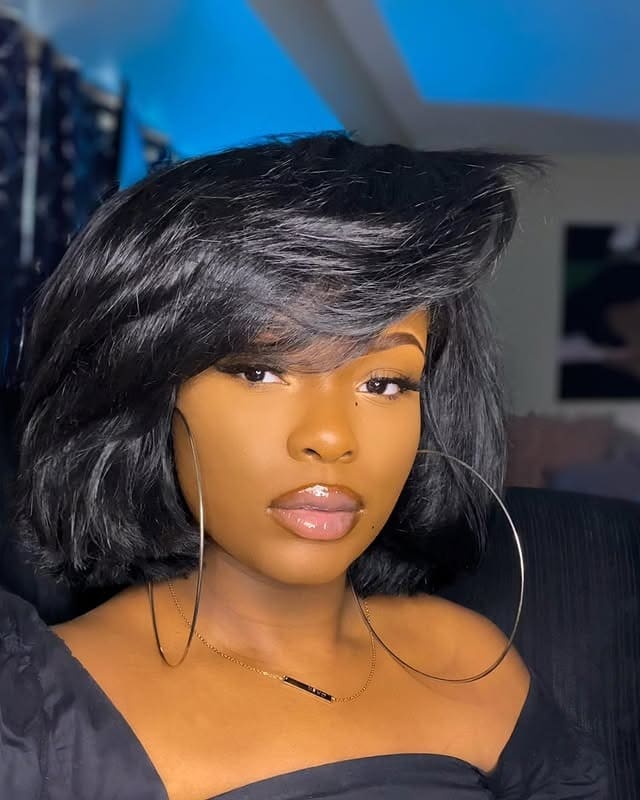 21. Sleek Black Fluffy Bob with Side-Swept Volume - Short Fluffy Hair