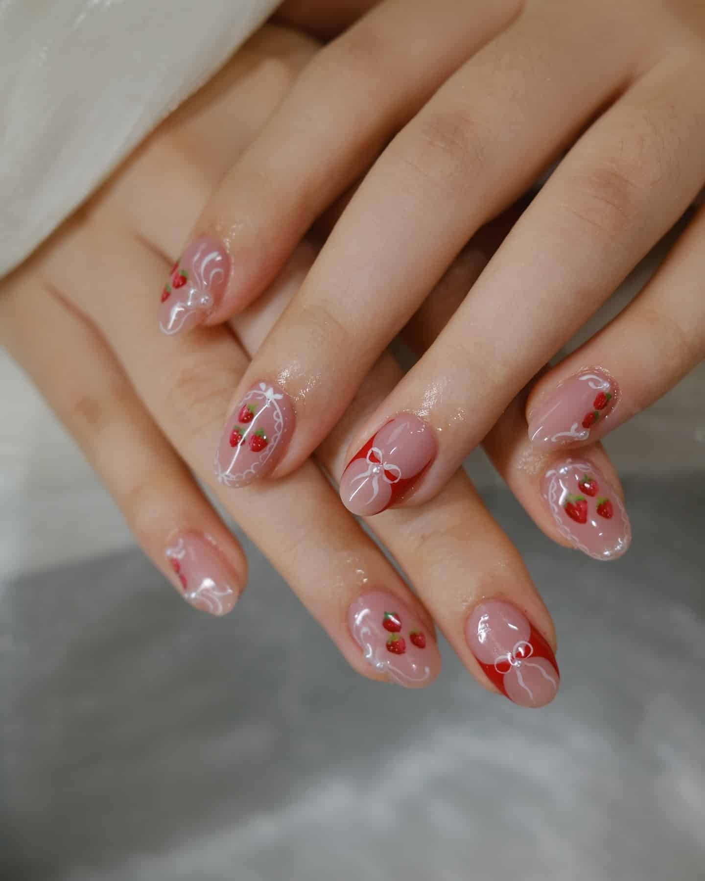 2. Sheer Pink Strawberry Nails with Ribbon Detail - strawberry nail ideas