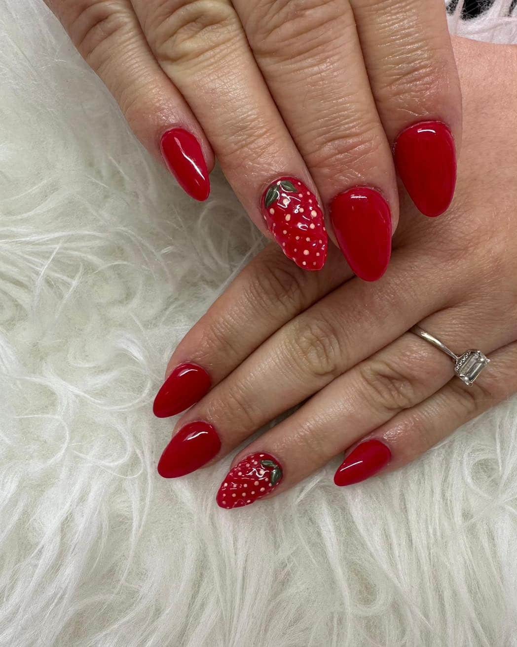 11. Glossy Red Almond Nails with Strawberry Accent - strawberry nail ideas