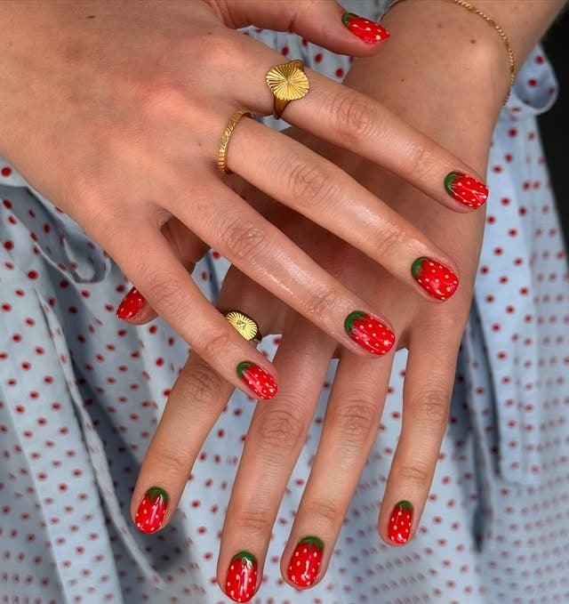 21. Full Strawberry Red Almond Nails with Green Tips - strawberry nail ideas