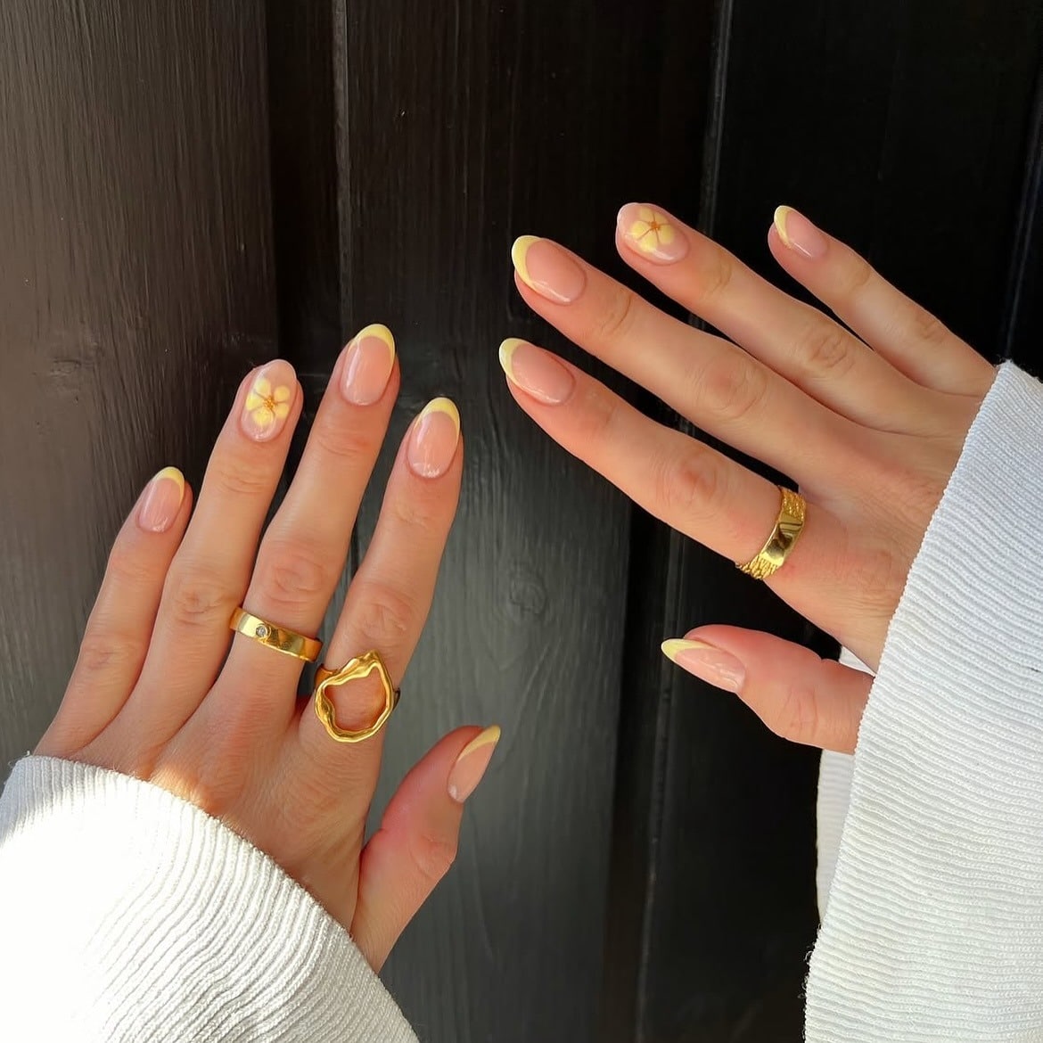 8. Lemon Yellow French Oval Nails with Floral Accent - summer oval nail ideas