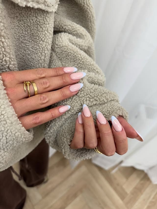 10. Baby Blue French Tip Oval Nails - summer oval nail ideas