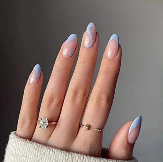 22. Soft Blue Swirl French Oval Nails - summer oval nail ideas
