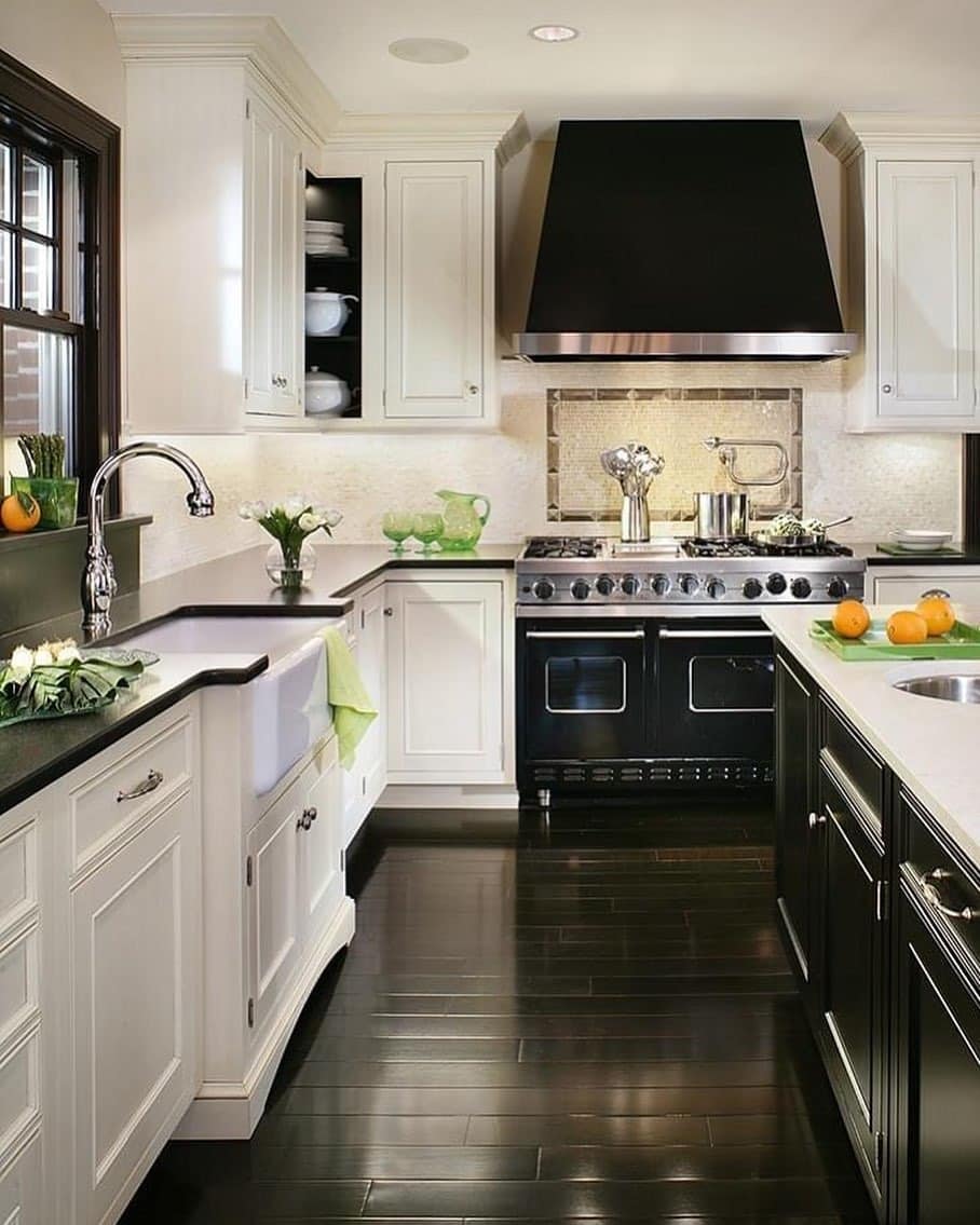 1. Classic Contrast Kitchen with Black Range Hood and White Cabinetry - black and white kitchen ideas
