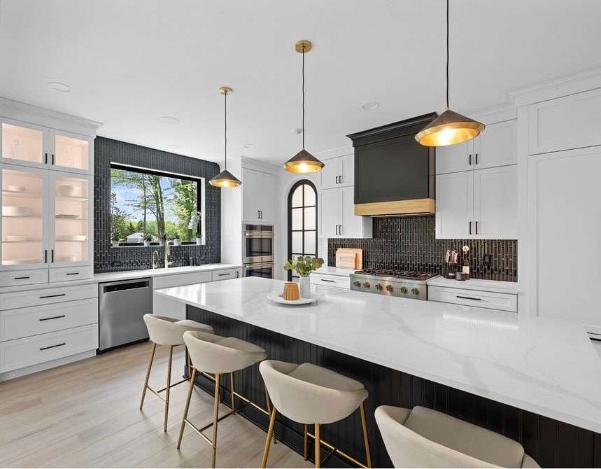 9. Modern White Kitchen with Black Hood and Textured Backsplash - black and white kitchen ideas
