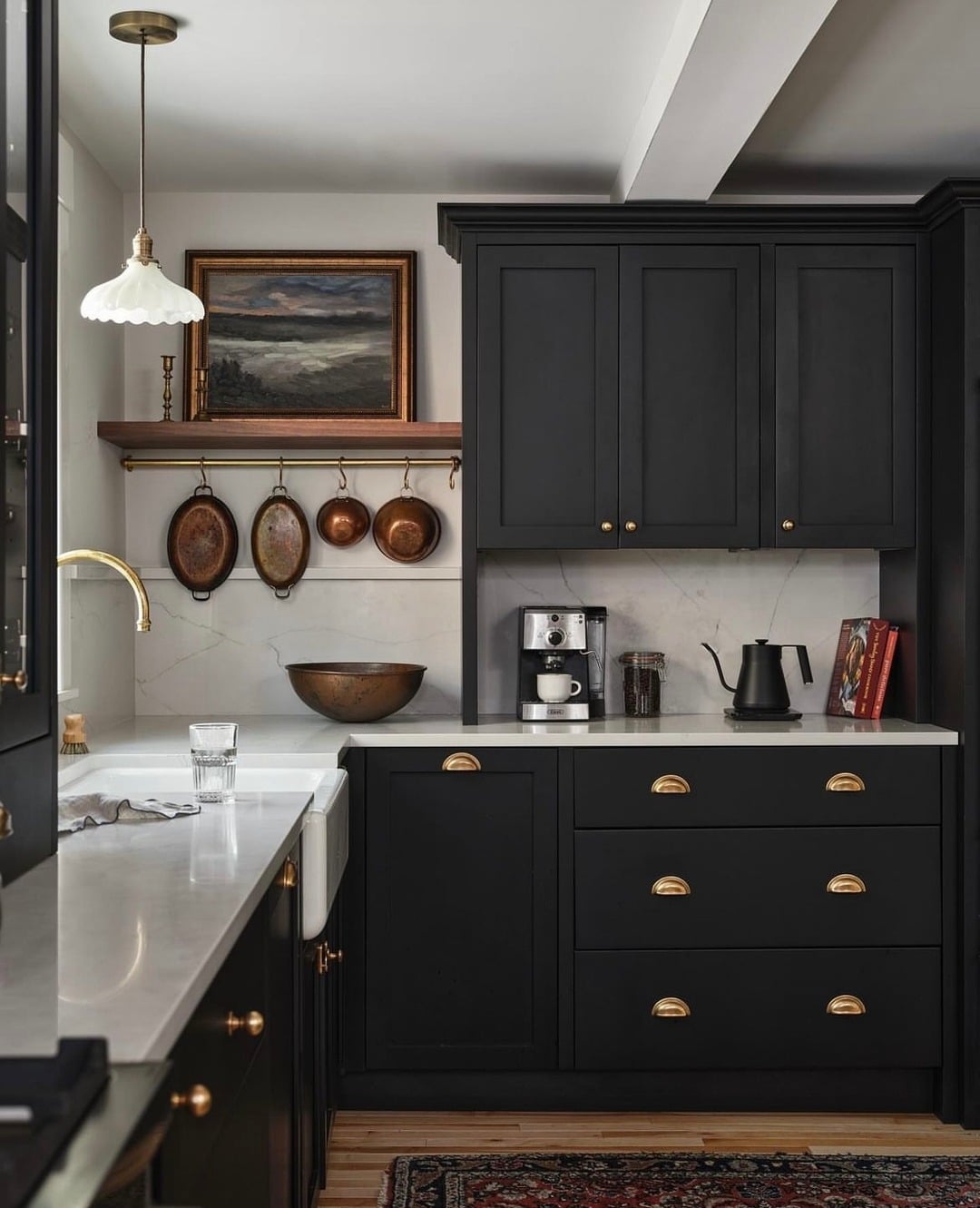 16. Traditional Black Cabinet Kitchen with Brass Hardware Details - black and white kitchen ideas